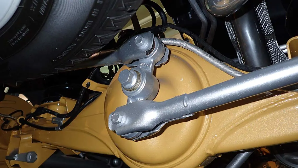 Close-up of car linkage components with joints and connectors